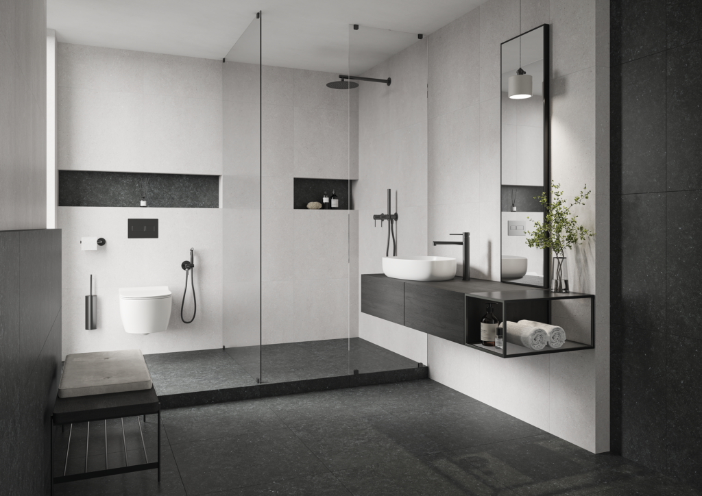 Nowoczesna łazienka w stylu industrialnym z armaturą w kolorze Gun Metal, prysznicem walk-in i szarymi płytkami imitującymi beton.